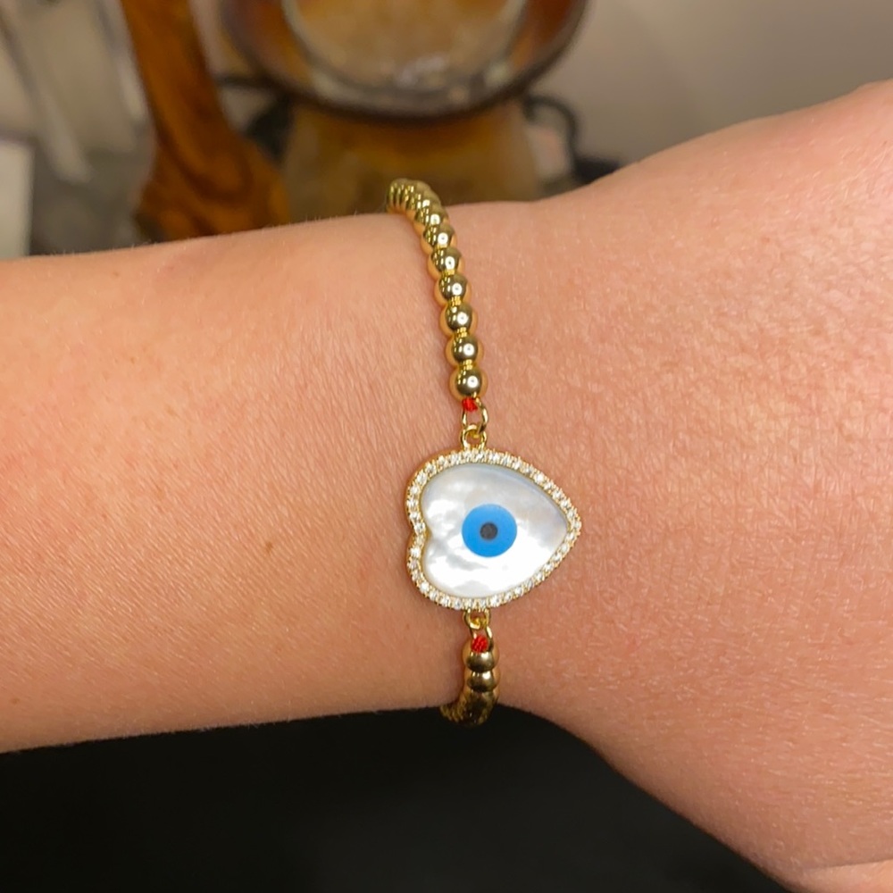 Evil eye bracelet with red string, heart